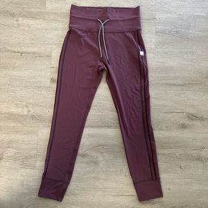 NWOT vuori daily leggings purple burgundy with stripes on side